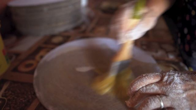 North OSSETIA village life. Grandmother cooks OSSETIAN PIES.