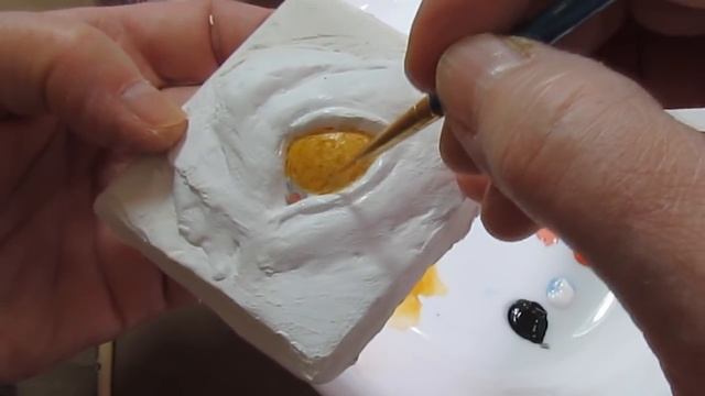 Painting Dog Eyes On Paper Mache Sculpture