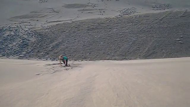 Jen Running Down A Sand Dune