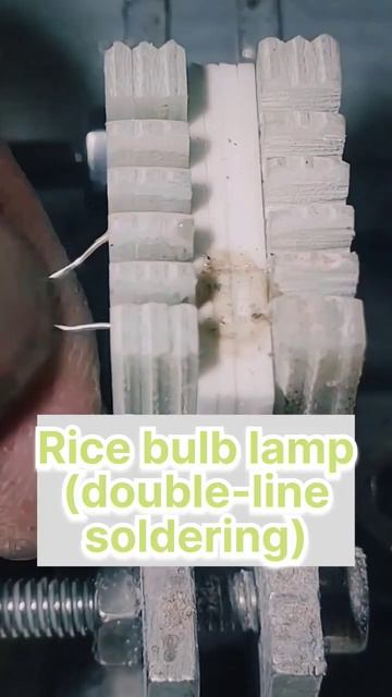 Automatic Simultaneous Soldering Of Rice Light Bulbs With Wires Close-up