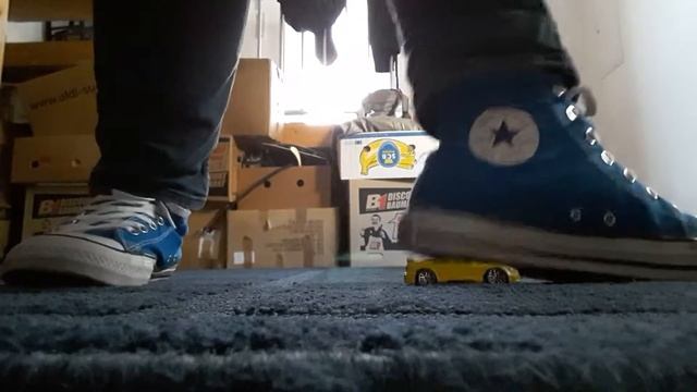 Blue Converse Playing With Yellow Car