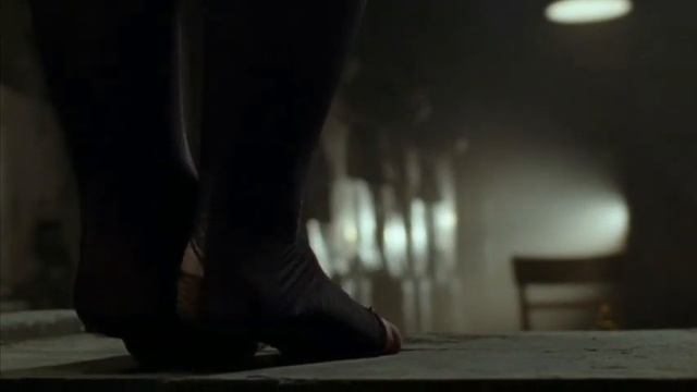 Hanging woman tied-up and choking on tiptoes scene