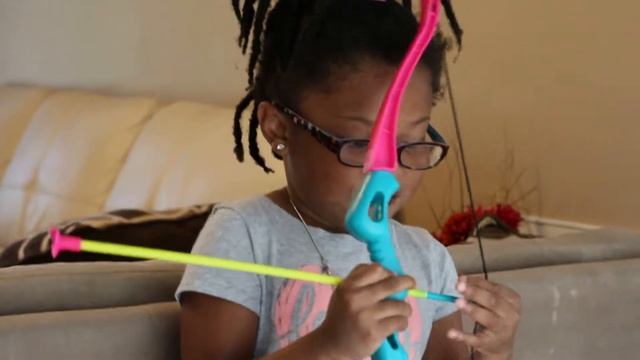 Archer Sylvia Shoots A Doll Off Of Dad's Head With Her Bow!