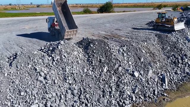 Amazing new project, throwing large rocks into deep lake with experts working quickly