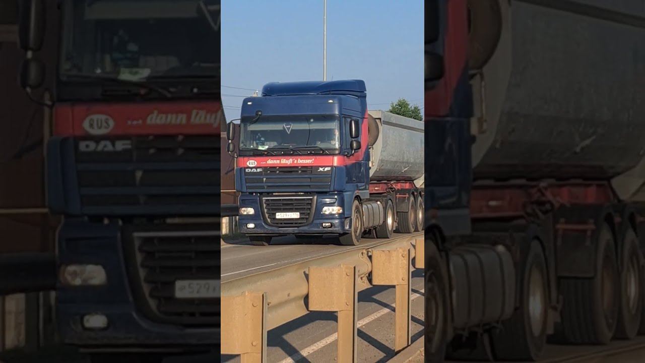 A blue dump truck carries sand in its back.