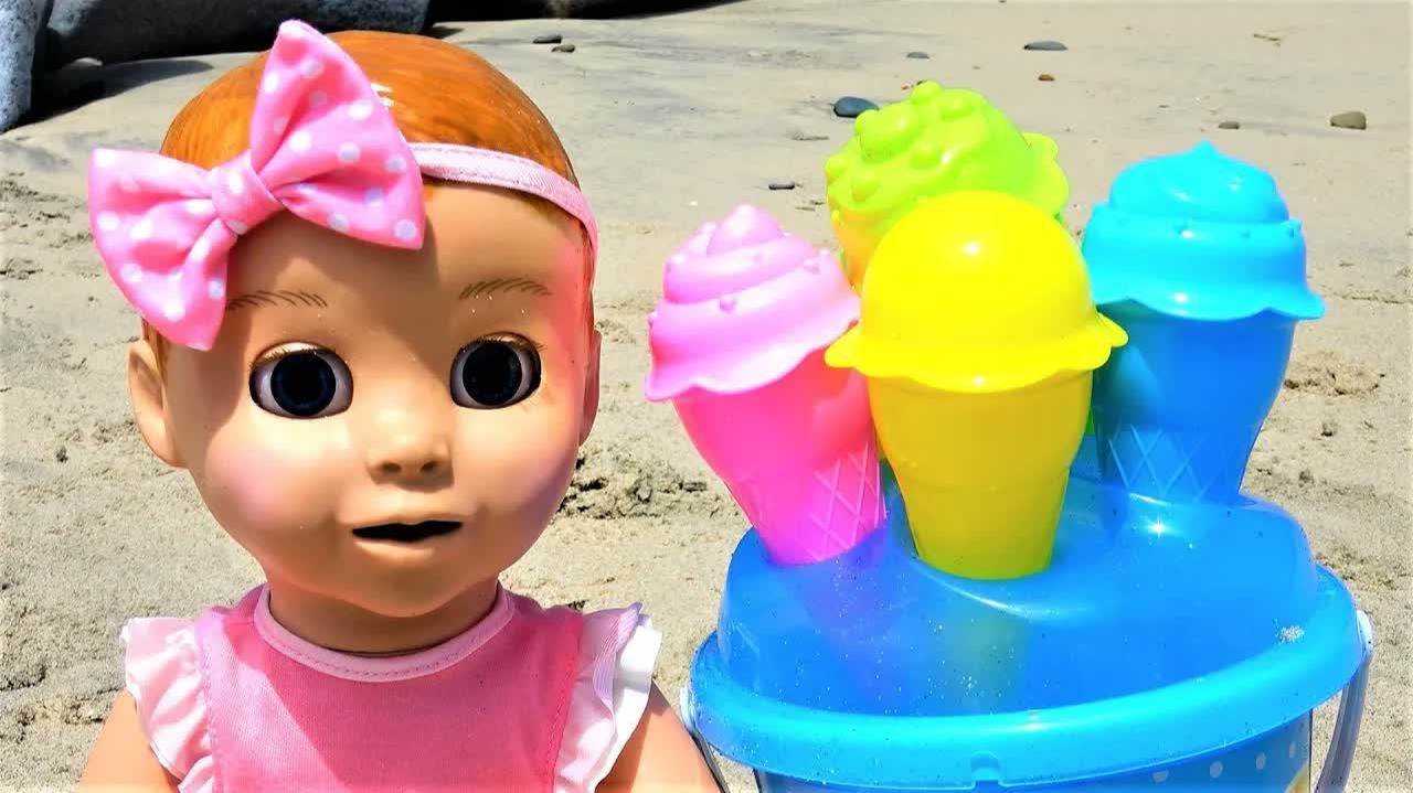 Polina Playing Sand Molds And Dolls On The Beach.