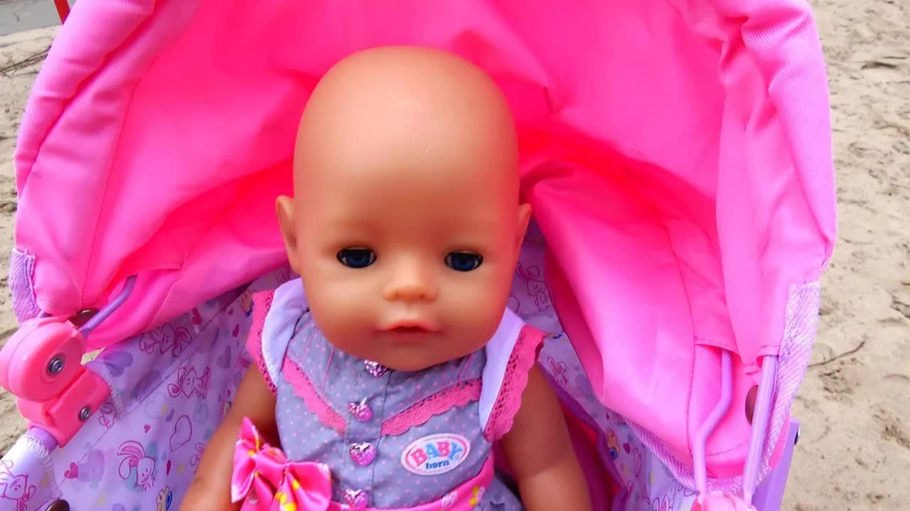 Baby Born playing with sand molds