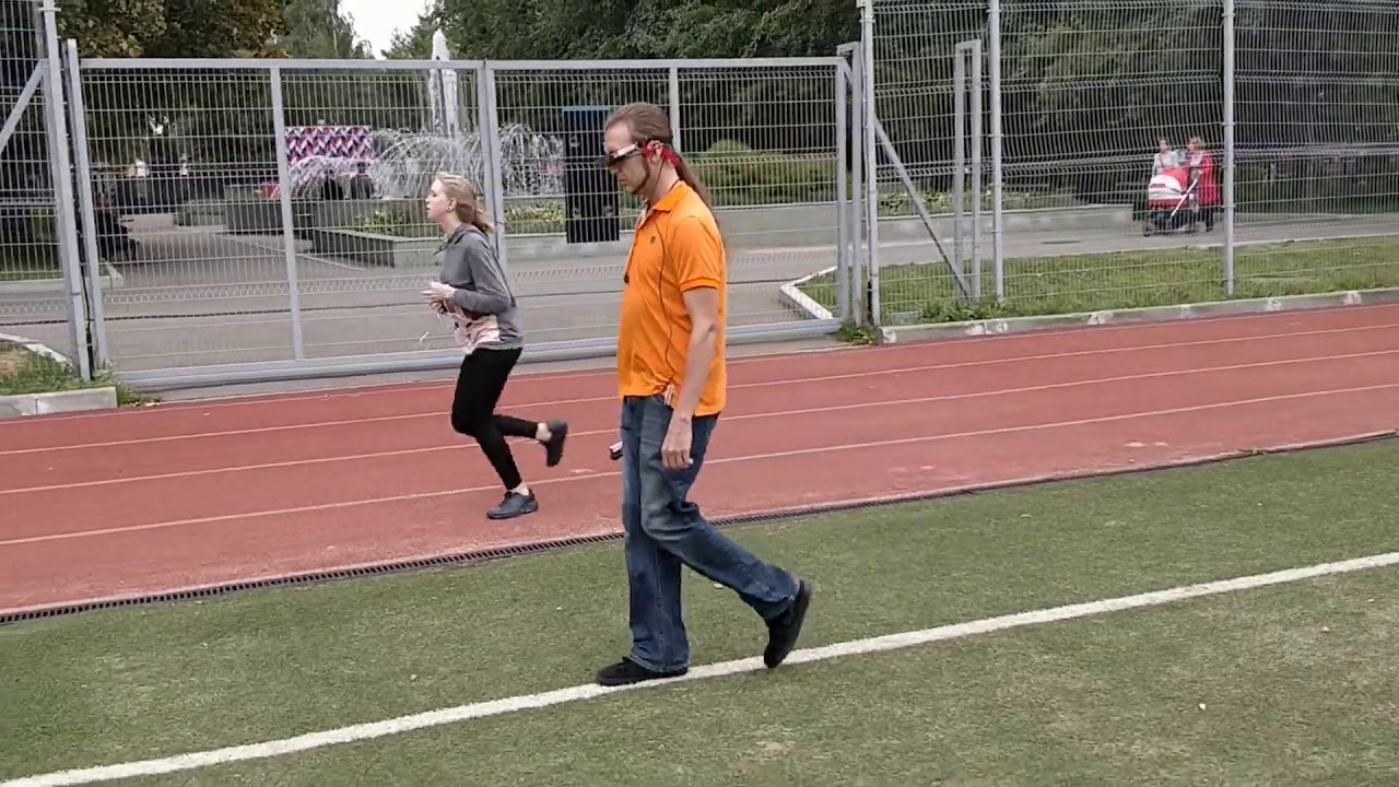 Russian Blind man following line on football field wearing The vOICe vision glasses