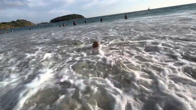 Kid Yan Swims In The Waves At Nai Harn Beach In Phuket