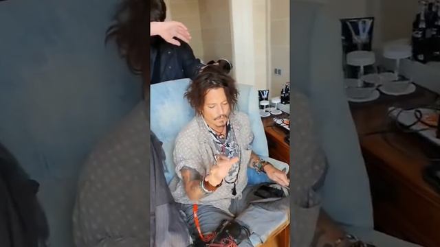 Johnny depp getting his hair done to attend bcn film festival