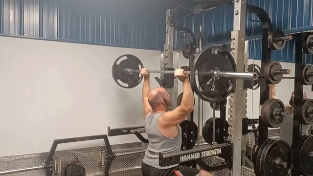 135 lb seated press