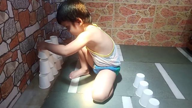 KID MAKING GLASS TOWER  3YR OLD AMAZING TECH.