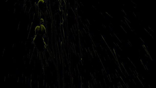 Футаж желтые брызги стекающие по стене на черном фоне