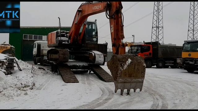 Эксковатор Хитачи 200 съезжает с трала