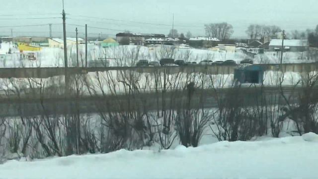 От Исакогорки до Архангельска из окна поезда зимой