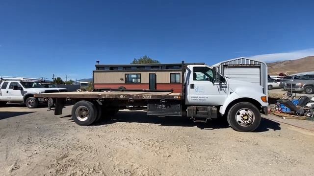 NE Masonry Auction Lot 246 - 2000 Ford F-650 Super Duty Flat Bed Truck.
