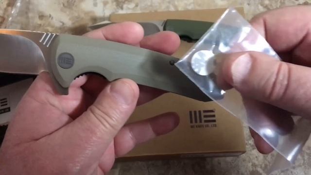 WE knife model 617 linerlock flipper with D2 blade and G10 scales titanium hardware budget friendly смотреть онлайн