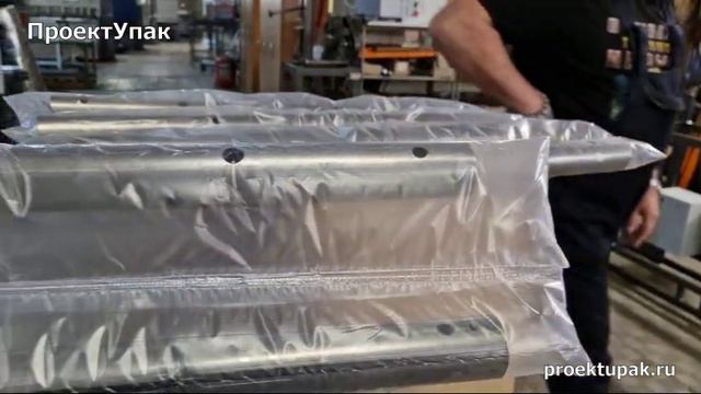 Автоматический оборачивающий узел для групповой упаковки длинномерной продукции. смотреть онлайн