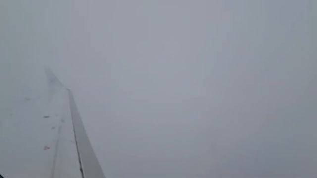 Decenting through clouds and land in Strasbourg airport in France. смотреть онлайн