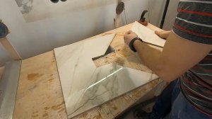 Оформление разуклонки из плитки к трапу.