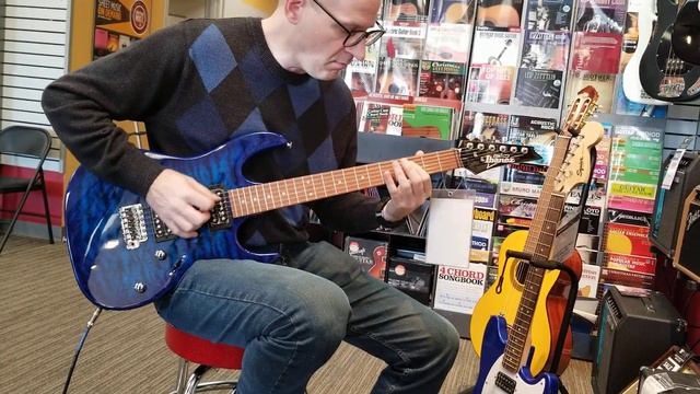 Playing an Ibanez GRX70QA electric guitar смотреть онлайн