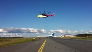 Вертолёт МИ-26 (UTair) перевозит самолёт ТУ-134. Helicopter  MI-26 transports airplane TU-134.