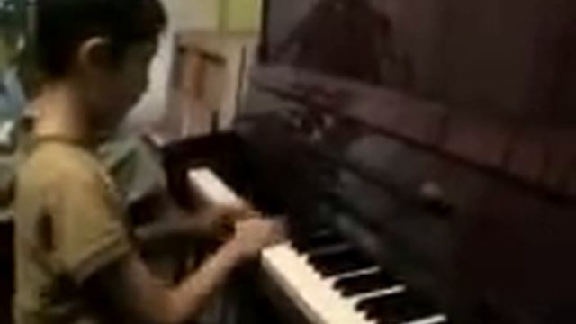 10-years-old composer Aspan plays own beautiful music.10-летний композитор Аспан смотреть онлайн