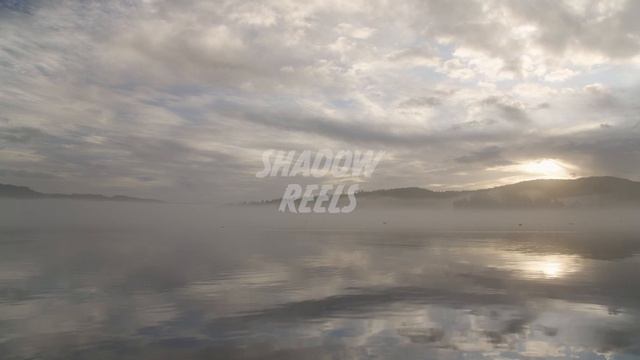 [STOCK FOOTAGE] Sunrise Reflection Off The Coast Of Sooke BC