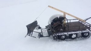 Мотобуксировщик с отвалом для чистки снега