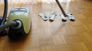 Vacuuming up white socks with miele vacuum