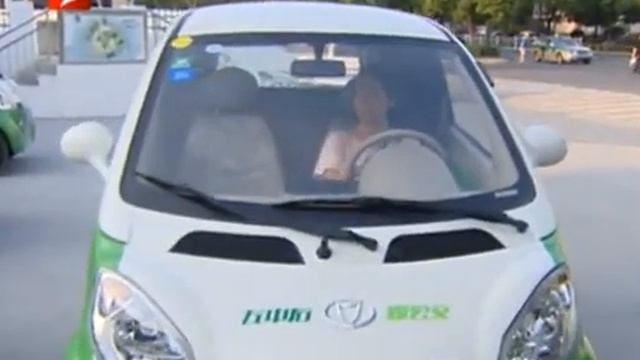 Kandi Technologies Hangzhou China 1st CarShare tower, Zhejiang TV News clip.. смотреть онлайн