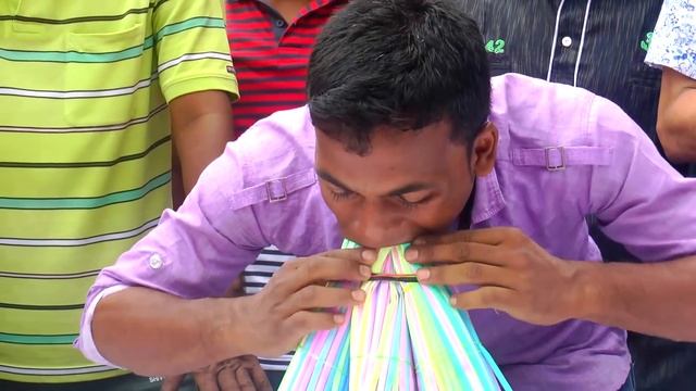 Most straws stuffed in the mouth - Guinness World Records смотреть онлайн