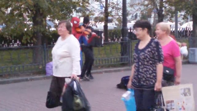 Batman and Spiderman play the violin and accordion