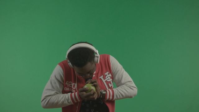 cheerful afro american man with white headphones having fun and playing with apple he with smiling смотреть онлайн