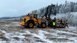 Работа фронтального погрузчика Вольво L180H.
