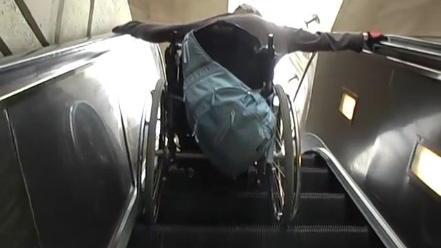 How To - Travel in a metro train and go down the escalator with a wheelchair смотреть онлайн