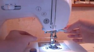 заправить нить в иглу швейной машины?