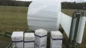 Обмотчик рулонов для упаковки  сенажа в полимерную пленку.