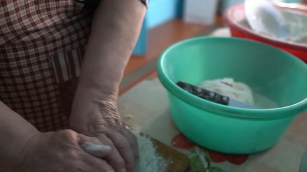 Happy elderly couple lives in the taiga forest far from civilization. Life in Russian villages