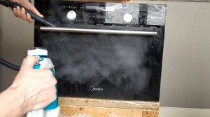Чистка поверхности духовки и варочной панели от масляных пятен  с пароочистителем КТ-918-3 Kitfort.