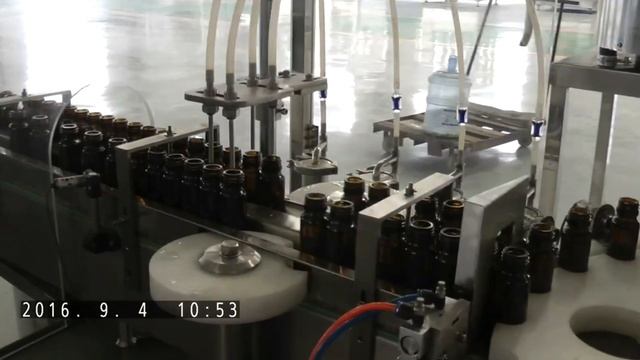 Essential oil bottles filling glass dropper feeding inserting capping MC máquina de llenado смотреть онлайн