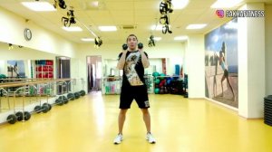 Жим гантелей стоя параллельным хватом