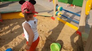 Дети гуляют на улице, играют на детской площадке, играют с мячом. Children play with a ball