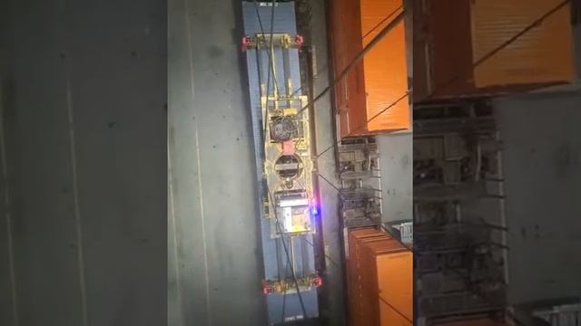 unloading a yard truck and loading a train in a trainyard. liebherr intermodal container crane. смотреть онлайн