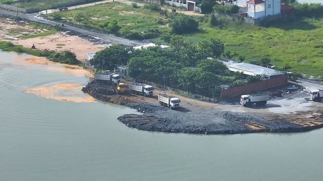 Action strongly Dump truck moving soil filling New Road Construction dozer in sand смотреть онлайн