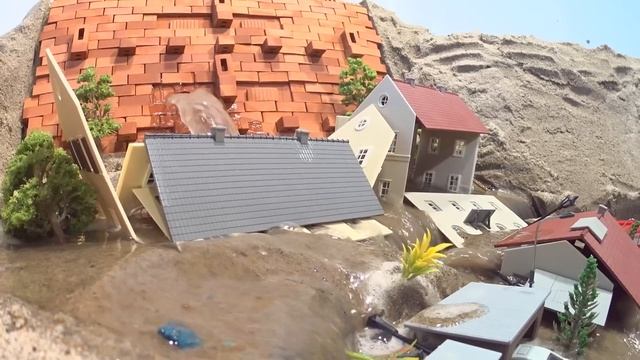 Emergency Water Discharge And Mini Brick Model Dam Failure Near Town - Diorama Dam Breach