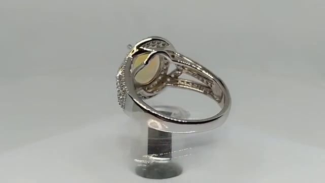 Кольцо с натуральным эфиопским опалом 1.63ct (10.4 х 8.2 мм) и белыми топазами смотреть онлайн