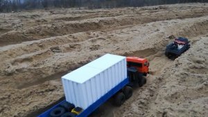 Rc Truck. wpl B36 ural & Kamaz 6x6 with a semi-trailer and a load on the sand. off-road.