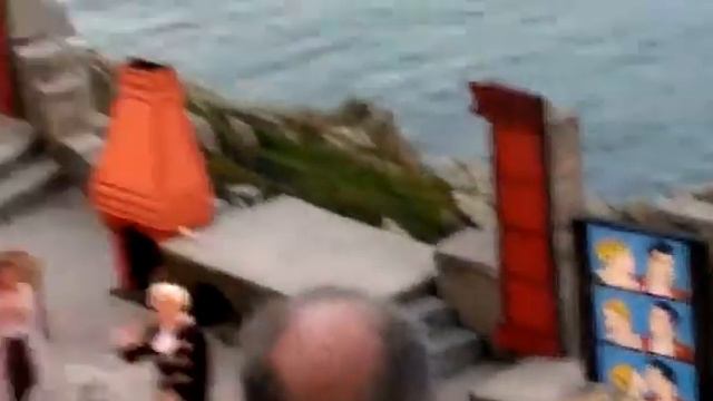 Pod of Dolphins swimming past Minack Theatre in Cornwall смотреть онлайн