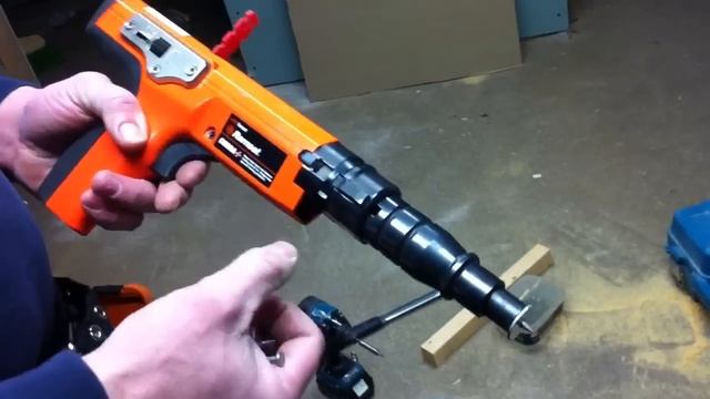 Nail Gun Drives Nails Into Concrete